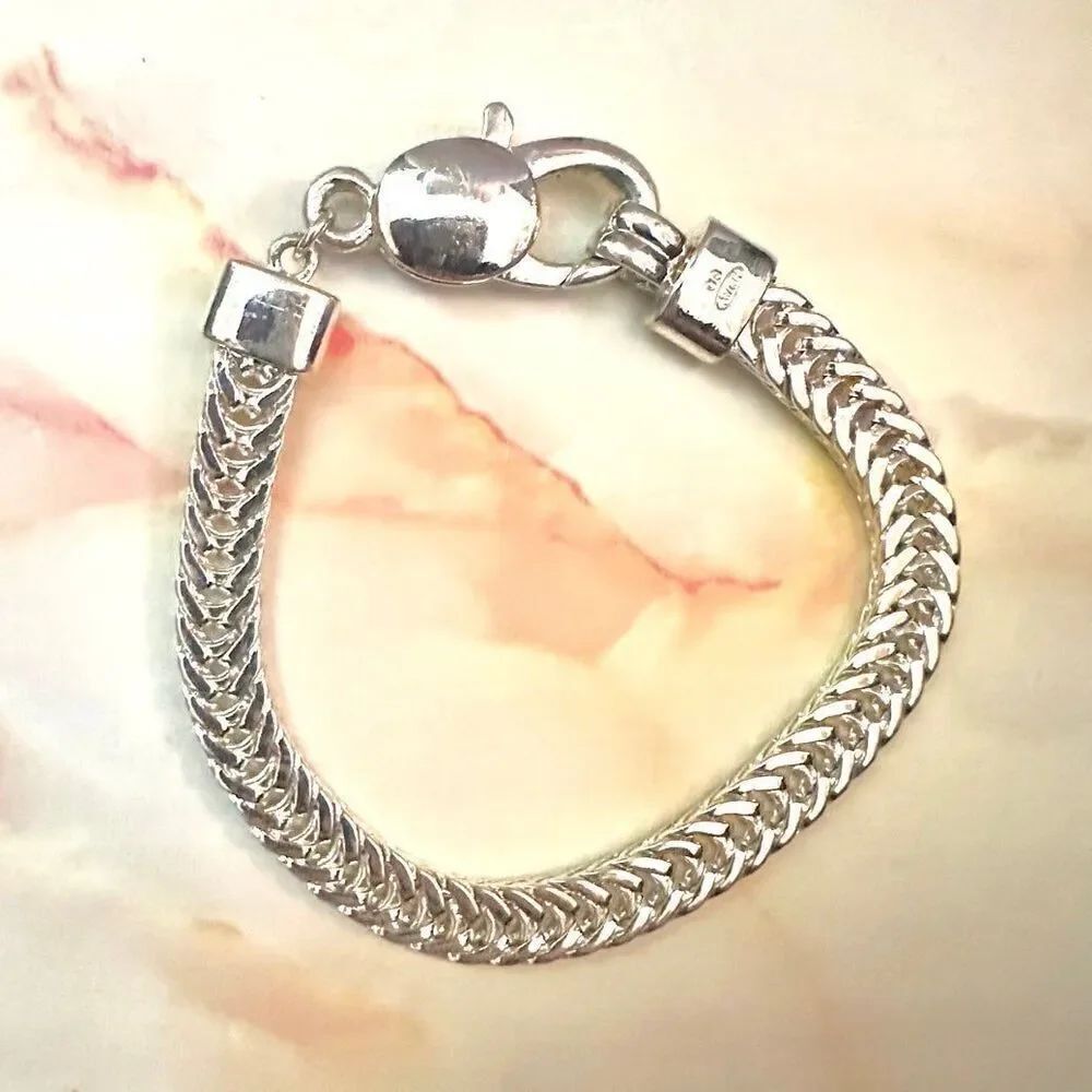 Avon silver tone braided bracelet